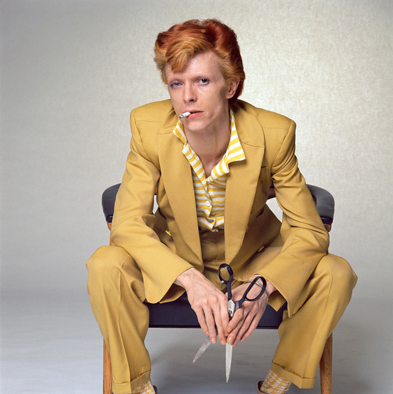 David Bowie, in Mustard Suit Holding Scissors (color), Los Angeles, 1974