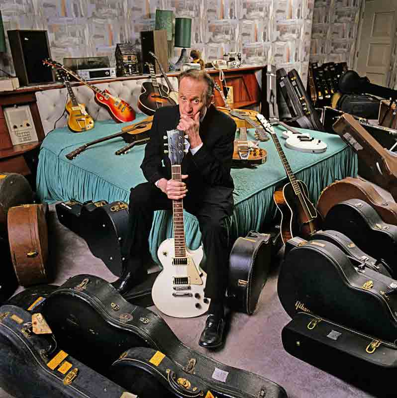 Les Paul Portrait with Guitars, Sitting on Bed, NJ